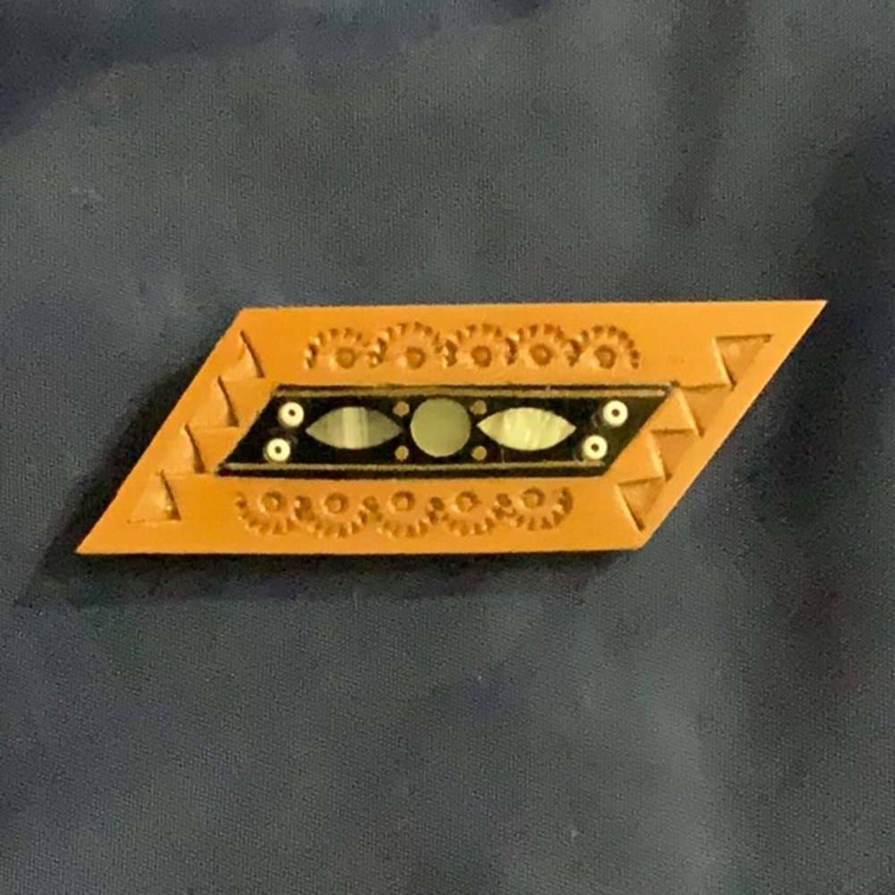 Hand carved wooden “Hutsul” brooch - made in Ukraine.  Mother of pearl inlay.
